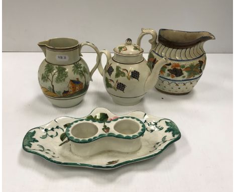 A 19th Century pearl ware teapot with grape and vine decoration, together with two further 19th Century pearl ware jugs, one 