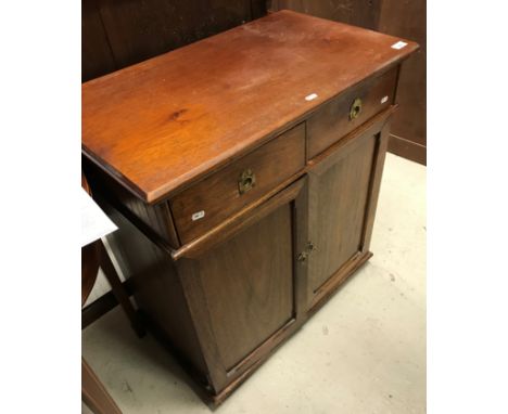 A late Victorian oak side cabinet, the plain top above two short and two cupboard doors, raised on bracket feet, 74 cm wide x