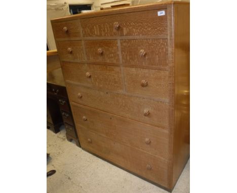 A Betty Joel oak chest of seven various short over three long drawers with shell carved handles bearing label verso inscribed