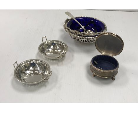 A pair of George V silver pierced sweetmeat dishes, both with twin handles (Birmingham 1915), together with a pierced silver 