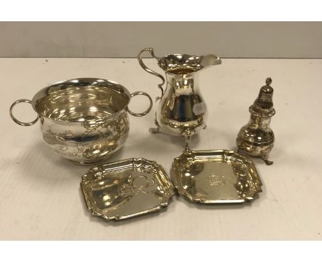A collection of silver comprising twin-handled porringer, a baluster shaped cream jug, a pair of silver Royal Gloucestershire