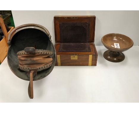 A 19th Century mahogany and brass bound writing slope, together with a turned pedestal wooden bowl, a copper coal helmet and 