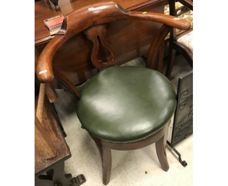 An early 20th Century mahogany framed swivel chair, together with a 19th Century mahogany elbow chair in the Chippendale mann