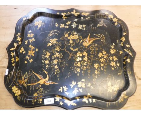 A Victorian papier-mache and black lacquered and gilt decorated tray, the centre field decorated with exotic birds amongst fo