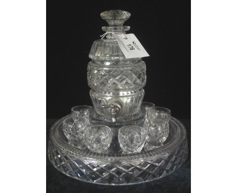 Cut glass barrel shaped spirit decanter and stopper together with circular stand and eight shot glasses.(B.P. 24% incl. VAT)