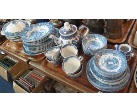 Two trays of various blue and white items to include: Alfred Meakin 'English Village' bowls; plates; tureens etc. Churchill E