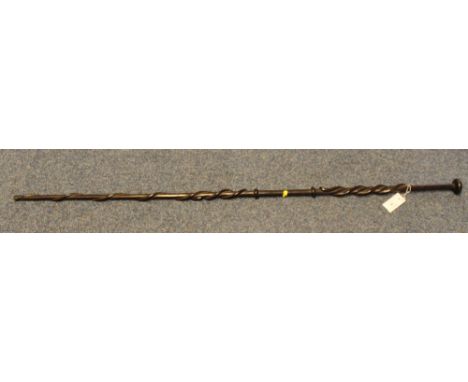 Carved and moulded hardwood tall stick, probably African with wrythen decoration and mushroom terminal.(B.P. 24% incl. VAT)  