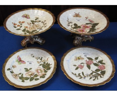 Royal Worcester porcelain part dessert service comprising: two comports or tazzas, raised on tripod design bases and two plat