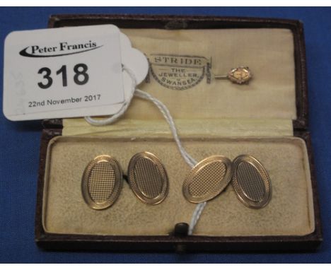Cased pair of 9ct gold, engine turned oval cuff links, together with hat pin, the box marked: Stride the Jeweller, Swansea.(B