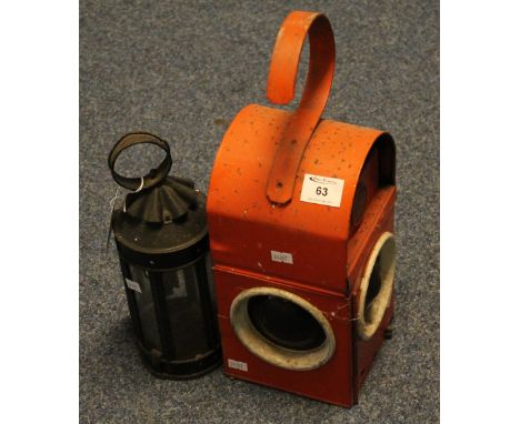 A Supreme Caro pwd red roadworks lantern together with a cylindrical hand lantern.  (2)(B.P. 24% incl. VAT)