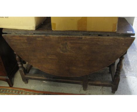 18th Century oak gate legged table.(B.P. 24% incl. VAT)