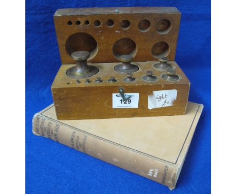 Box of brass chemical spring balance weights together with single volume "The law relating to weights and measures" revised b
