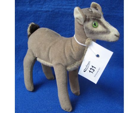 Mid 20th Century Steiff standing brown fawn with nickel plated button to ear and green glass eyes.  17.5cm long approx., 17.5