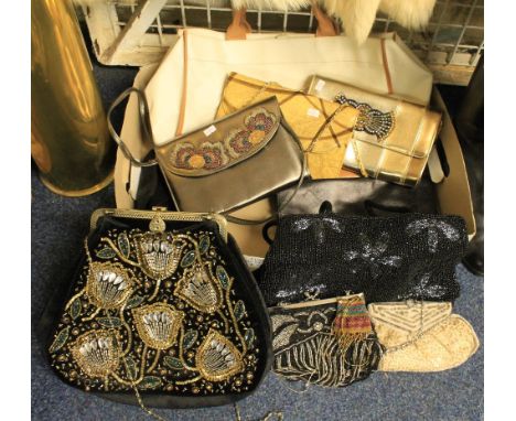 Box of vintage bags to include leather, fabric, plastic and beaded bags (70's-90's). Bags include a silver leather bag with b