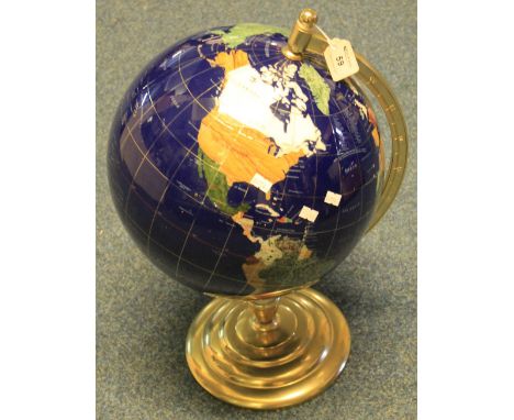 A modern ceramic and brass table globe.(B.P. 24% incl. VAT)