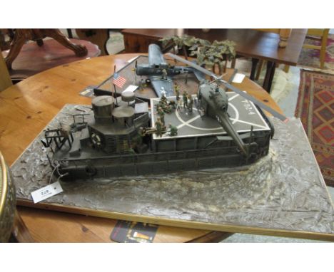 Scale model Diorama of a micro flat topped hospital boat, US Riverline Force Vietnam with Bell Huey on rectangular naturalist