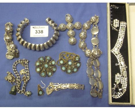 Bag of assorted costume jewellery to include: bangle; necklace; cruciform pendant; charm bracelets; gate bracelet with heart 