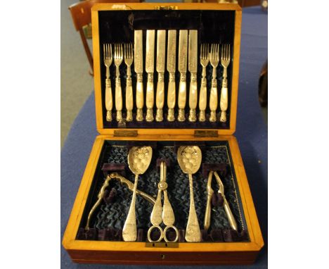 Cased part canteen of cutlery, silver plated with mother-of-pearl handles, with engraved initials.(B.P. 24% incl. VAT)