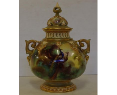 Royal Worcester twin handle lidded pot pouri jar circa 1905, with hand painted peacock and floral decoration, signed W.E.Jarm