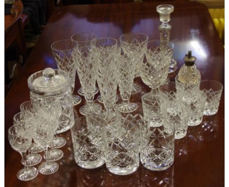 Twenty eight assorted cut crystal glasses together with a cut crystal lidded jar, candlestick and perfume bottle