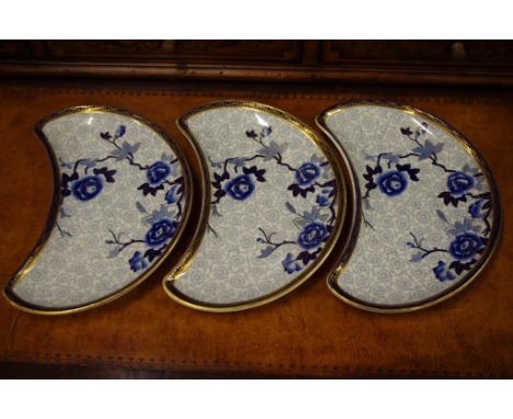 Three antique Royal Worcester crescent plates