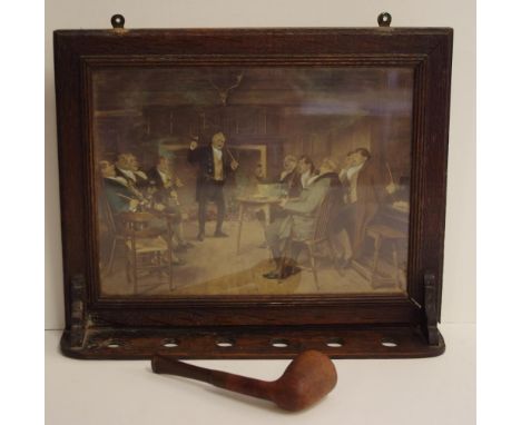 Vintage oak framed pipe stand wall mounted for 6 pipes, with an old pipe