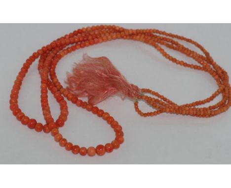Vintage double strand pink-red coral bead graduated in size 6mm - 1.5mm beads, with pink silk tassle, size: longest drop 38cm