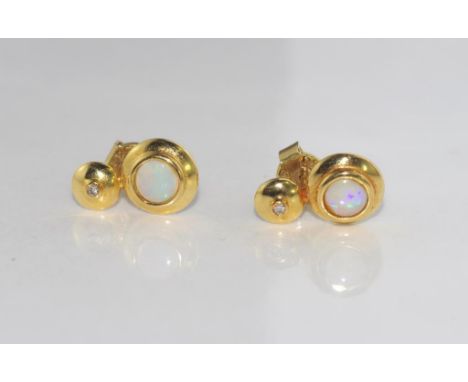 18ct yellow gold, solid opal and diamond studs with 14ct yellow gold backs, total weight: approx 3.5 grams