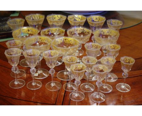 Fine set of 24 antique Venetian wine glasses of varying sizes with gilded & enamel decoration, hand blown, the bowls with fac