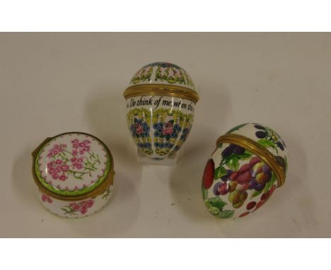 Three 'Halycon Days' enamel trinket boxes to include two egg shaped 6 cm long, and one other