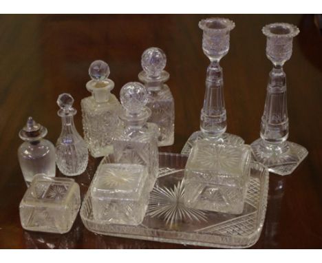 Antique cut crystal dressing table set to include a pair of candlesticks, 2 perfume bottles, 2 lidded trinket boxes and one e