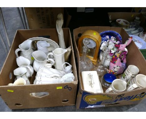 Two boxes of china including Cream Ware, butter dishes, jugs, clock, decanter etc