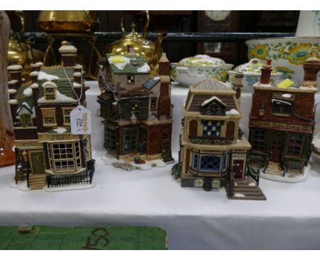 Four model houses in The Dickens Village Series by Department 56 