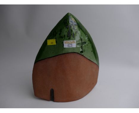 Art Pottery statue marked with green glazed tip with impressed cross