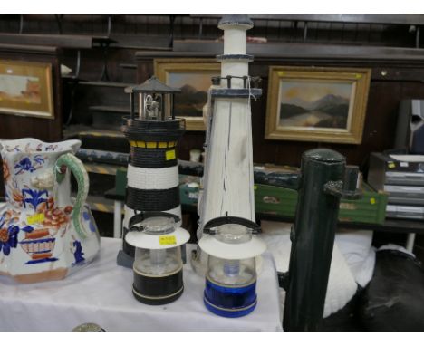 Two model lighthouses and pair of lanterns 