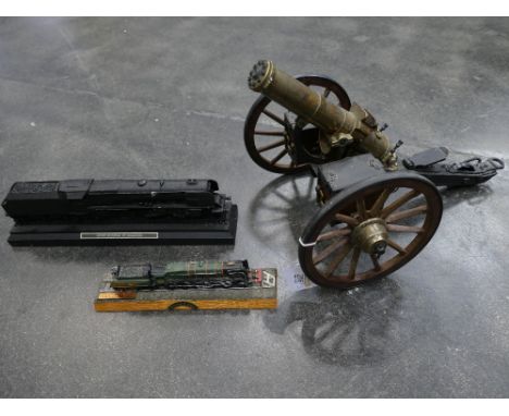 Model Gatling Gun and two model trains, Duchess of Hamilton and Evening Star 