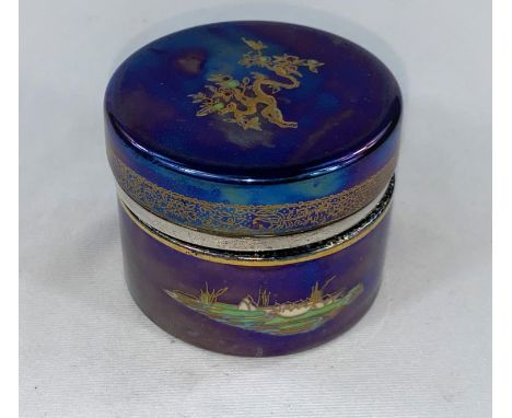 An Art Deco inkwell, Carltonware style decorated in the Japanese manner on a blue ground, with hallmarked silver rim to the l