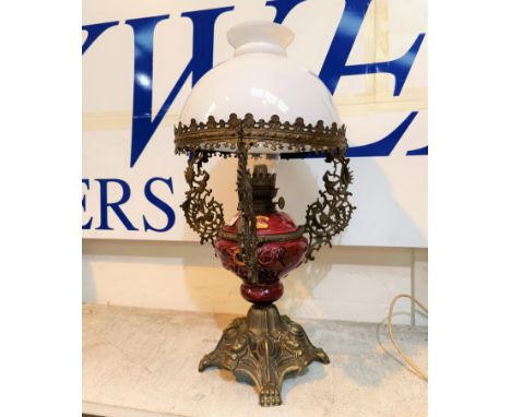 An ornate table oil lamp in red pottery and cast brass ---In good condition, no condition issues noted