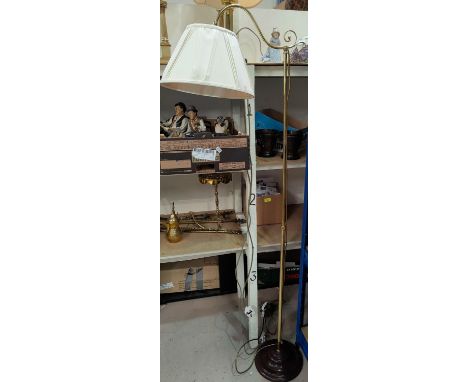 A brass standard lamp; table lamps.&nbsp;&nbsp;This standard lamp is modern.