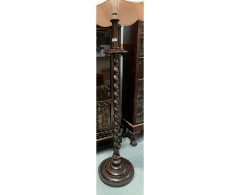 A 1930's wooden barley twist standard lamp 