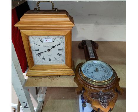 A reproduction bracket clock in pine case; an Edwardian barometer in mahogany case (glass a.f.) 