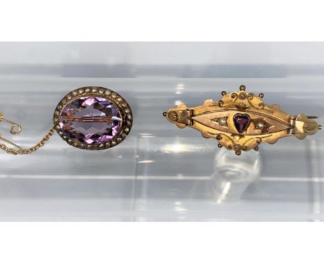 A Victorian 9 carat hallmarked gold brooch set amethyst and seed pearls , 4.2 gm; an amethyst and seed pearl brooch 