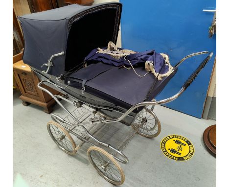 A vintage Silver Cross pram in blue (collectors' item only)