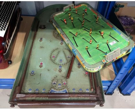 A 1960's tinplate table football game; a bagatelle board 