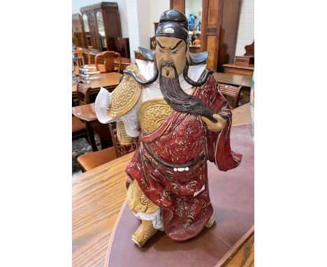 A large Chinese stoneware figure of a man, impressed seal mark to the underside interior, height 53cm (1 hand missing).&nbsp;