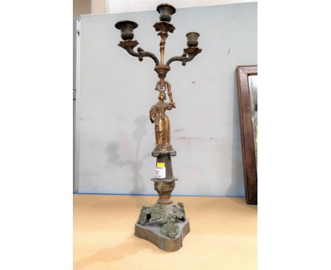 An Ormolu "French Empire" 3 branch candelabra with female figure column &amp; trefoil scrolled feet. Height 48cm. 