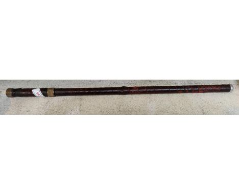 An early 20th century swagger stick wrapped in leather with blade inside 