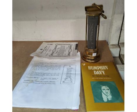 A reproduction miners safety lamp, Humphrey Davey, with booklet