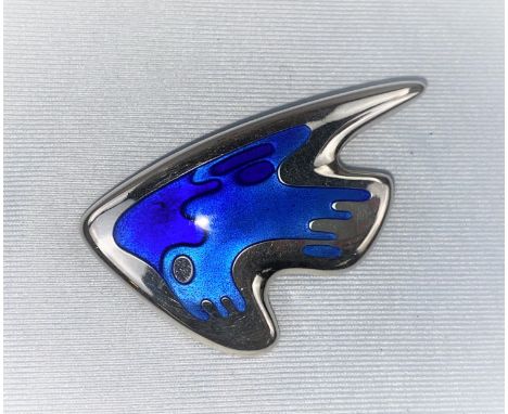 A Georg Jensen silver brooch: stylised fish, with body in shades of blue enamel, designed by Henning Koppel, stamped on raise