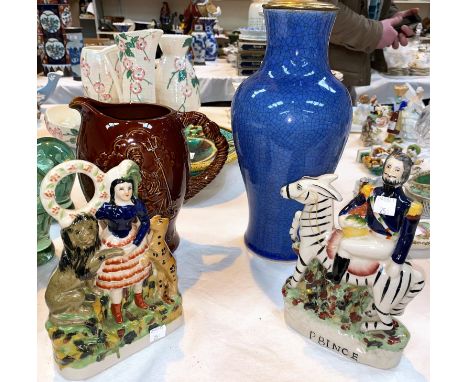 A John Bull Britannia jug with brown glaze; a modern pair of Staffordshire figures; an oriental pottery baluster table lamp i